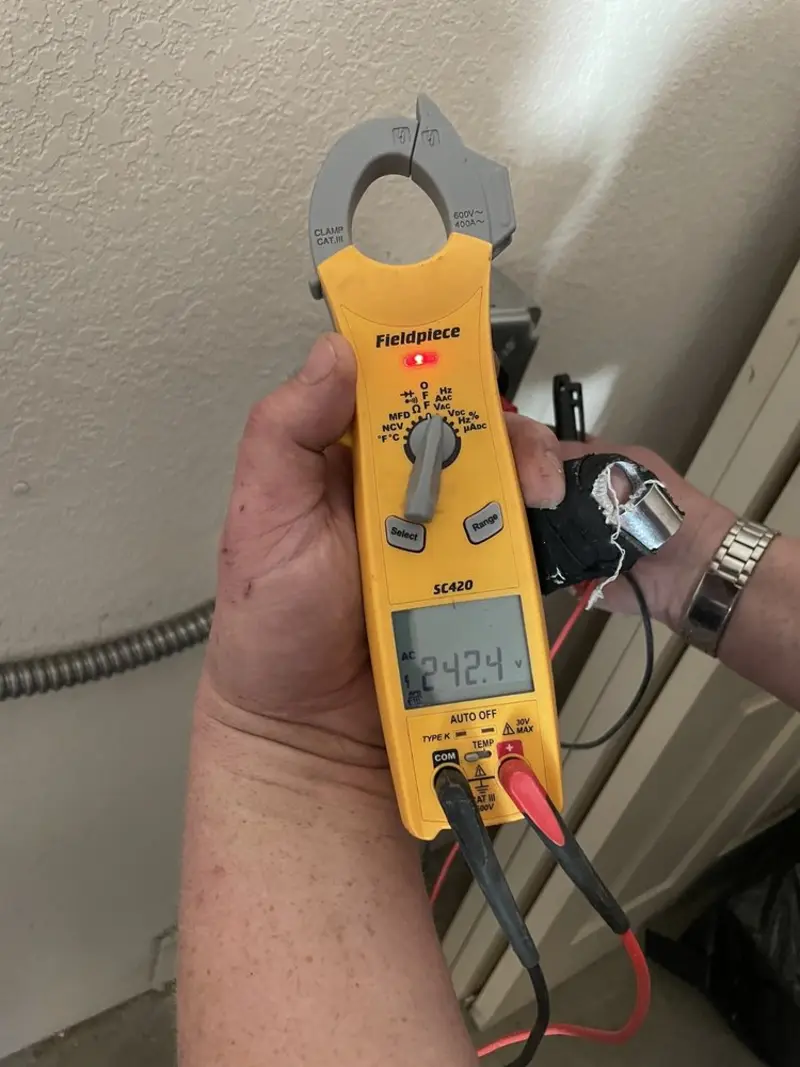 Voltage testing with clamp meter during Generator Installation in Riviera Beach